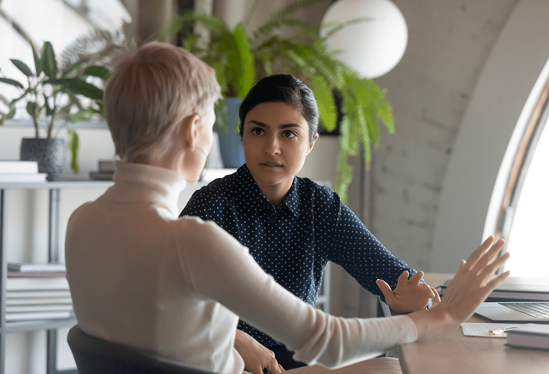 Two women having a serious discussion