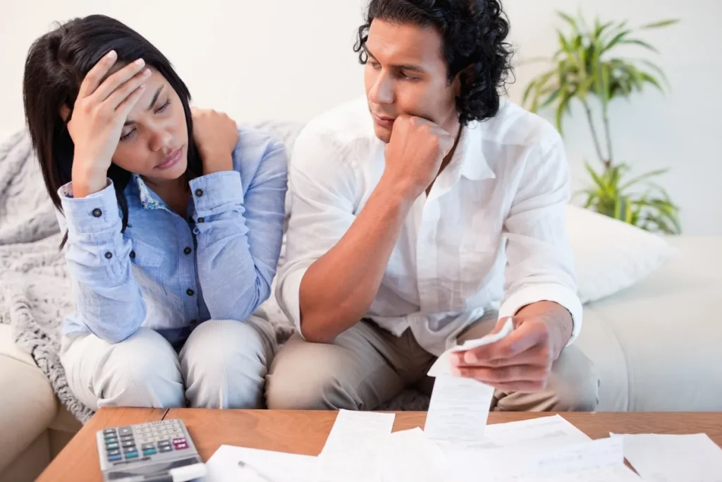 Man and woman discussing financial documents