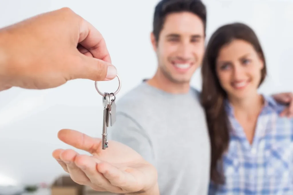 Handing over keys to couple