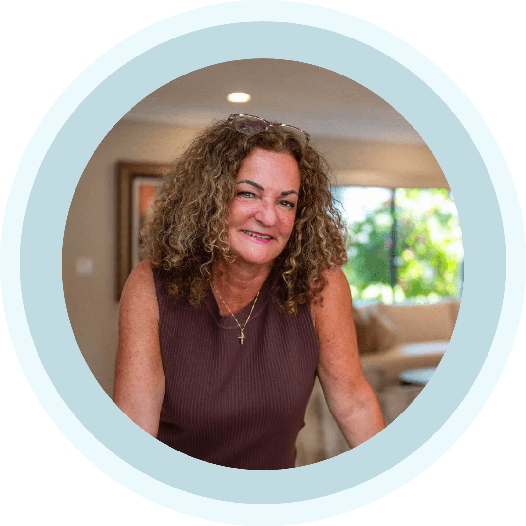 Smiling woman with curly hair in living room
