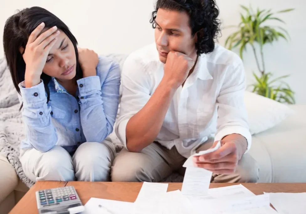 Man and woman discussing financial documents