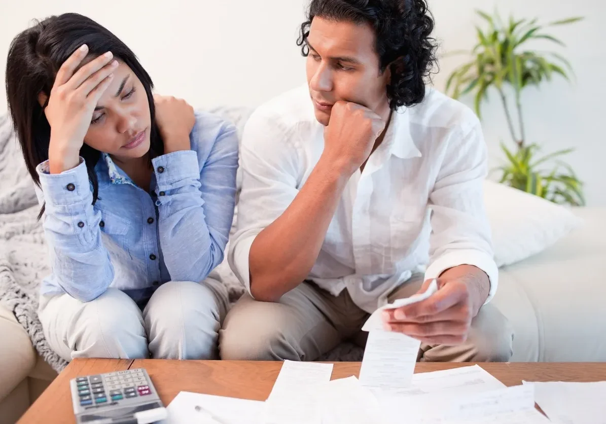 Man and woman discussing financial documents