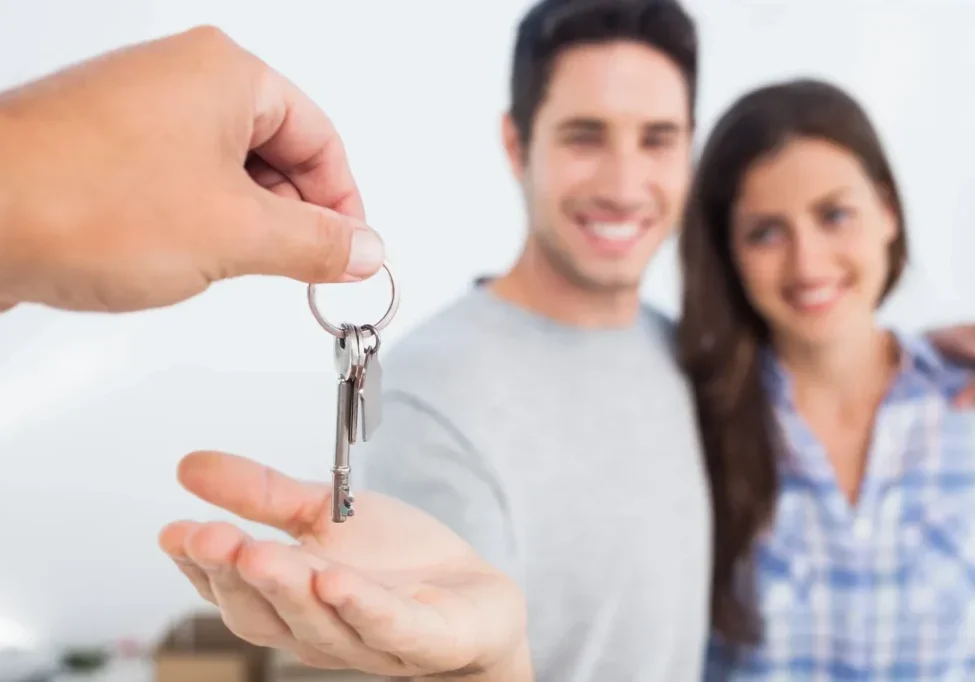 Handing over keys to couple
