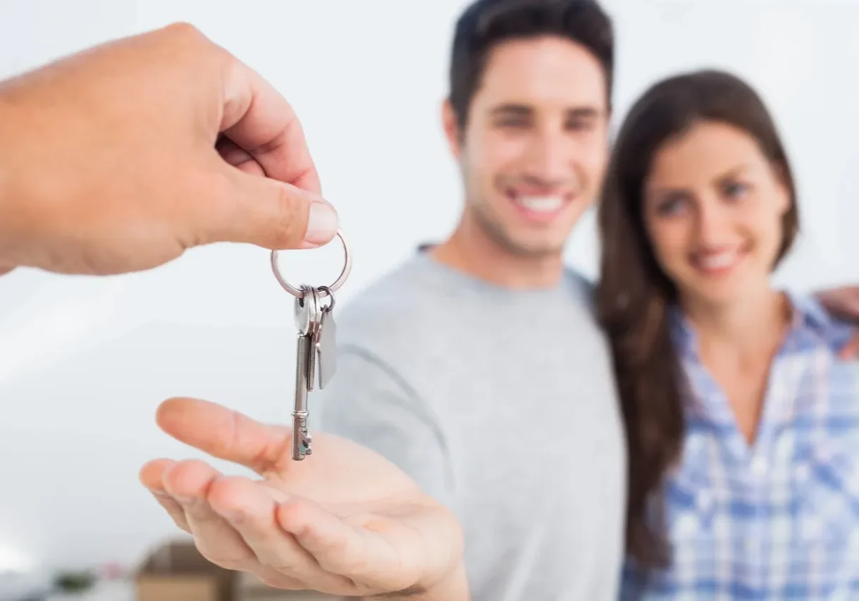 Handing over keys to couple